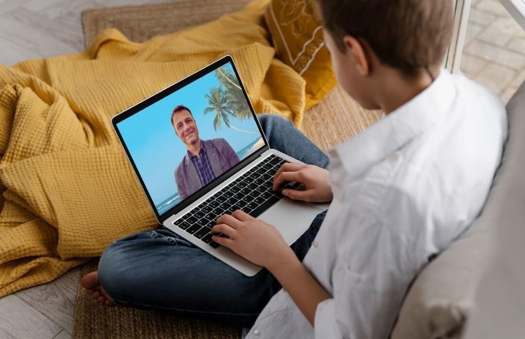 Adolescent Therapy: A young person looking at his laptop with Emile on the screen.